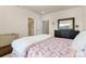 Comfortable bedroom with a dresser and view to ensuite bathroom at 132 Ambrose St, Erie, CO 80516