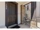 Inviting front porch with stone pillar accents and a cozy seating area at 132 Ambrose St, Erie, CO 80516