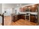 Open kitchen with stainless steel appliances, dark countertops, and plenty of cabinet space at 132 Ambrose St, Erie, CO 80516