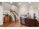 Bright kitchen with stainless steel appliances and a view of the living area at 132 Ambrose St, Erie, CO 80516