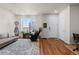 Spacious living room with hardwood floors, plenty of natural light, and stylish furnishings at 132 Ambrose St, Erie, CO 80516
