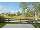Backyard view with a concrete patio, wooden fence, and green space at 12921 Grant Cir # B, Thornton, CO 80241