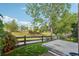 Backyard with a concrete patio, wooden fence, and lush green surroundings at 12921 Grant Cir # B, Thornton, CO 80241