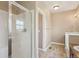 Bathroom featuring walk-in shower with white tiling at 12921 Grant Cir # B, Thornton, CO 80241