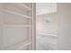 Bedroom featuring built-in bookshelf with view to window at 12921 Grant Cir # B, Thornton, CO 80241