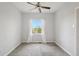 Bright bedroom featuring neutral walls, carpet, ceiling fan, and a window with natural light at 12921 Grant Cir # B, Thornton, CO 80241