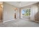 Brightly lit bedroom with a fan and large windows at 12921 Grant Cir # B, Thornton, CO 80241