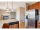 The kitchen features stainless steel appliances, granite countertops, and wood cabinets at 12921 Grant Cir # B, Thornton, CO 80241