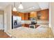 Modern kitchen features stainless steel appliances, granite countertops, and ample storage space at 12921 Grant Cir # B, Thornton, CO 80241