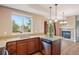 Spacious kitchen area featuring granite countertops, dark wood cabinets and stainless steel appliances at 12921 Grant Cir # B, Thornton, CO 80241