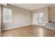 Spacious living room features hardwood floors, neutral paint, and ample natural light at 12921 Grant Cir # B, Thornton, CO 80241