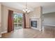 Open living room with hardwood floors, fireplace, and backyard access at 12921 Grant Cir # B, Thornton, CO 80241