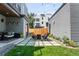 Stylish backyard featuring a fire pit, comfortable seating, and well-manicured landscaping at 2838 Tennyson St, Denver, CO 80212