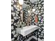 Elegant powder room with floral wallpaper, a floating sink, and decorative lighting at 2838 Tennyson St, Denver, CO 80212