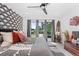 Bright bedroom with large windows, patterned wallpaper, and comfortable, stylish bedding at 2838 Tennyson St, Denver, CO 80212