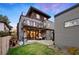 Contemporary home with multiple decks, manicured lawn, and stylish outdoor living spaces at 2838 Tennyson St, Denver, CO 80212