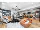 Spacious open-concept living room and kitchen featuring hardwood floors and designer lighting at 2838 Tennyson St, Denver, CO 80212
