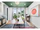 Bright office space with large windows, stylish furnishings, and hardwood floors at 2838 Tennyson St, Denver, CO 80212