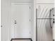Entryway and kitchen with stainless steel appliances, showcasing functional design at 2727 Folsom St # 303, Boulder, CO 80304