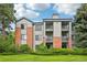 Well-maintained condo building with balconies, set on a green lawn at 2727 Folsom St # 303, Boulder, CO 80304
