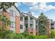 Attractive exterior of condo building featuring brick accents and balconies at 2727 Folsom St # 303, Boulder, CO 80304