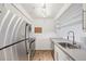Galley kitchen featuring stainless steel appliances and light wood cabinets at 2727 Folsom St # 303, Boulder, CO 80304