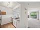 Kitchenette overlooking the living room, featuring modern fixtures and plenty of storage at 2727 Folsom St # 303, Boulder, CO 80304