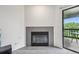 Living room showing fireplace and sliding door to balcony offering views at 2727 Folsom St # 303, Boulder, CO 80304