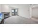 Spacious living room with cozy fireplace and access to a private balcony with scenic views at 2727 Folsom St # 303, Boulder, CO 80304