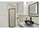White bathroom with modern fixtures, marble counters, and a glass shower stall at 13496 Alcott Way, Broomfield, CO 80020