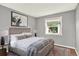 Bedroom with carpet, a bed with cactus painting, and a window at 13496 Alcott Way, Broomfield, CO 80020