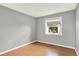 Bedroom with wood flooring, fresh paint, and a window at 13496 Alcott Way, Broomfield, CO 80020