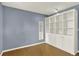 Bedroom with beautiful built-in shelving and cabinets, and warm hardwood floors at 13496 Alcott Way, Broomfield, CO 80020
