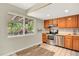 Functional kitchen featuring stainless steel appliances and a large window with backyard views at 13496 Alcott Way, Broomfield, CO 80020