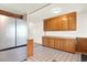 Spacious kitchen features stainless steel appliances, tile flooring and wooden cabinets at 13496 Alcott Way, Broomfield, CO 80020