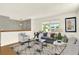 Cozy living room showcasing hardwood floors, ample seating, and lots of natural light at 13496 Alcott Way, Broomfield, CO 80020