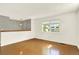 View of living room showing hardwood floors and fresh paint at 13496 Alcott Way, Broomfield, CO 80020