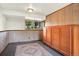 Room featuring wood paneling, natural light and a large wooden cabinet at 13496 Alcott Way, Broomfield, CO 80020