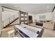 Spacious finished basement features modern stairs, sliding barn door, entertainment area, and game space at 55 Blue Flag Dr, Breckenridge, CO 80424
