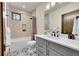 Well-lit bathroom features a tub and shower combo, a modern vanity and eye catching tile floor at 55 Blue Flag Dr, Breckenridge, CO 80424