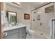Modern bathroom featuring a glass shower, gray vanity, and sleek fixtures at 55 Blue Flag Dr, Breckenridge, CO 80424