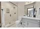 Modern bathroom featuring a glass-enclosed shower, white vanity, and elegant fixtures at 55 Blue Flag Dr, Breckenridge, CO 80424
