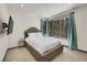 Relaxing bedroom with a large window, sleek tv and chic blue accents at 55 Blue Flag Dr, Breckenridge, CO 80424