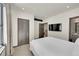 Bright bedroom with fresh white linens, an ensuite bath and modern black accents at 55 Blue Flag Dr, Breckenridge, CO 80424