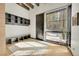 Entryway showcasing storage cubbies, a bench, a modern door, and bright natural light at 55 Blue Flag Dr, Breckenridge, CO 80424
