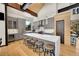 Modern kitchen with gray cabinets, a large island with seating, and stainless steel appliances at 55 Blue Flag Dr, Breckenridge, CO 80424
