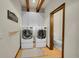 Well-equipped laundry room with modern washer and dryer, and ample storage space at 55 Blue Flag Dr, Breckenridge, CO 80424