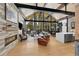 Spacious living room featuring a stone fireplace, high ceilings, and abundant natural light at 55 Blue Flag Dr, Breckenridge, CO 80424