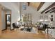Stylish living room featuring high ceilings, wood beams, large windows, and modern furnishings at 55 Blue Flag Dr, Breckenridge, CO 80424