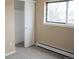 This bedroom features neutral walls, carpeted floors, a window, and a closet at 875 S Quebec St # 25, Denver, CO 80247